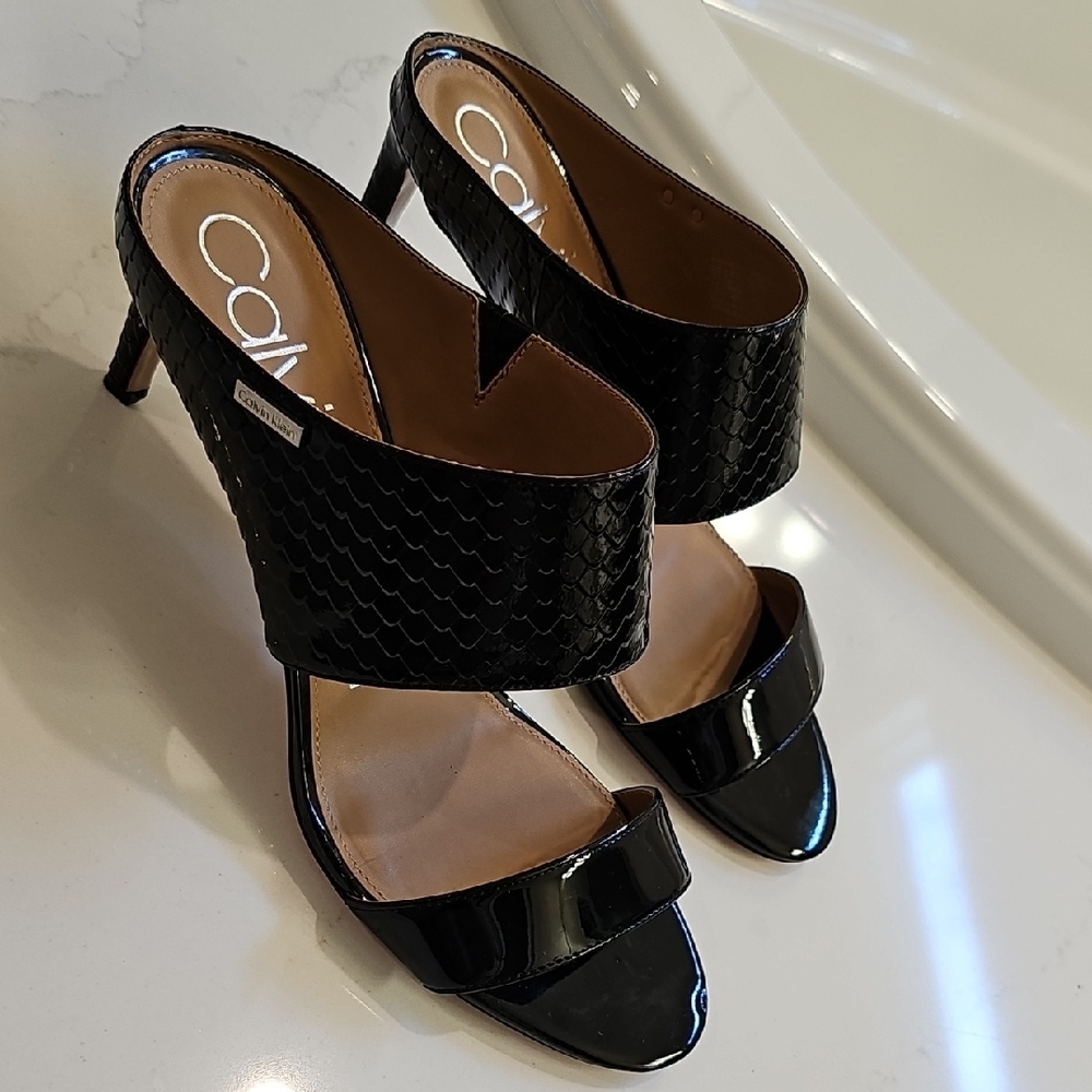 Calvin Klein Black Mules with Sleek Modern Silhouette